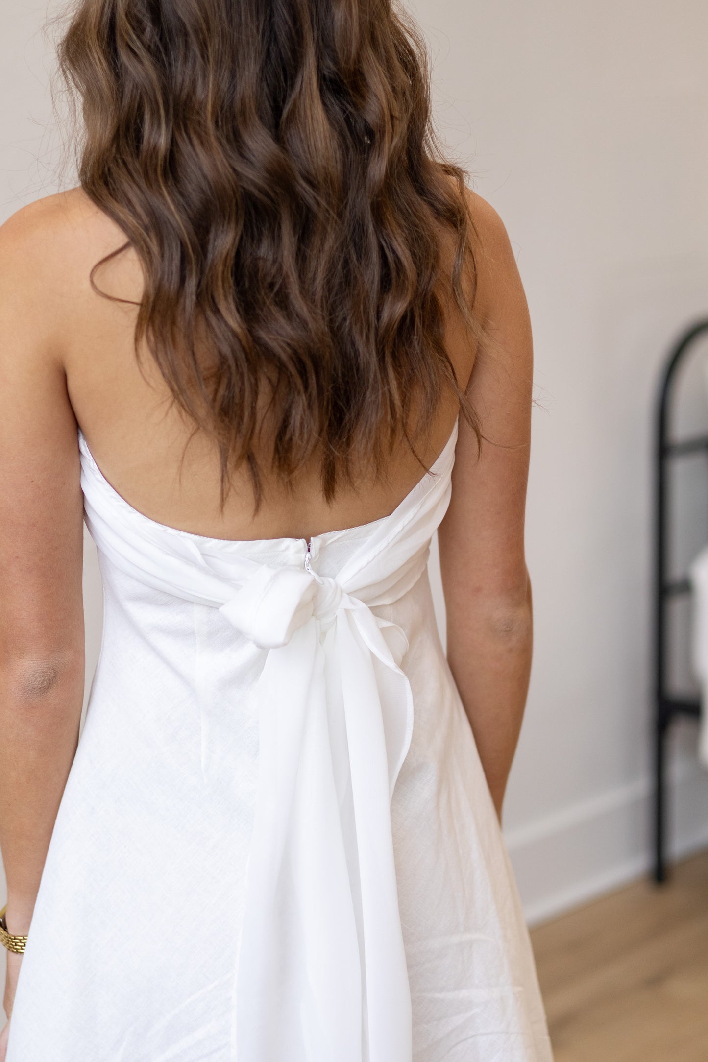 Person wearing a white dress with a blurred background