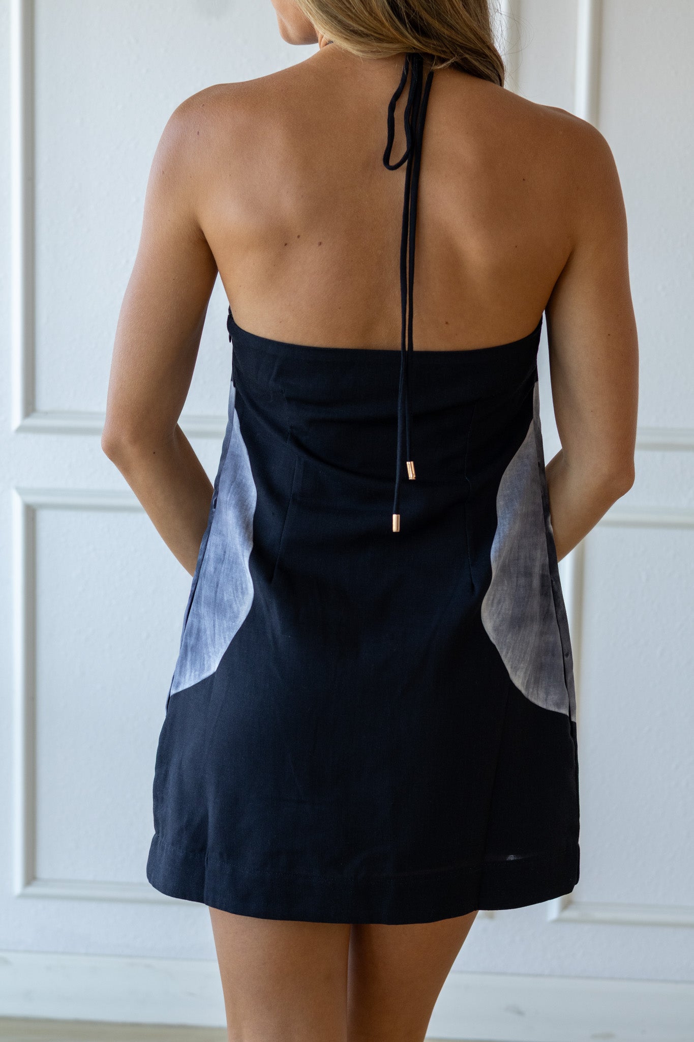 Black dress with a unique design on a white background